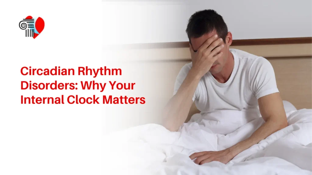 Exhausted man sitting in bed covering his face, representing sleep deprivation and circadian rhythm disorders.